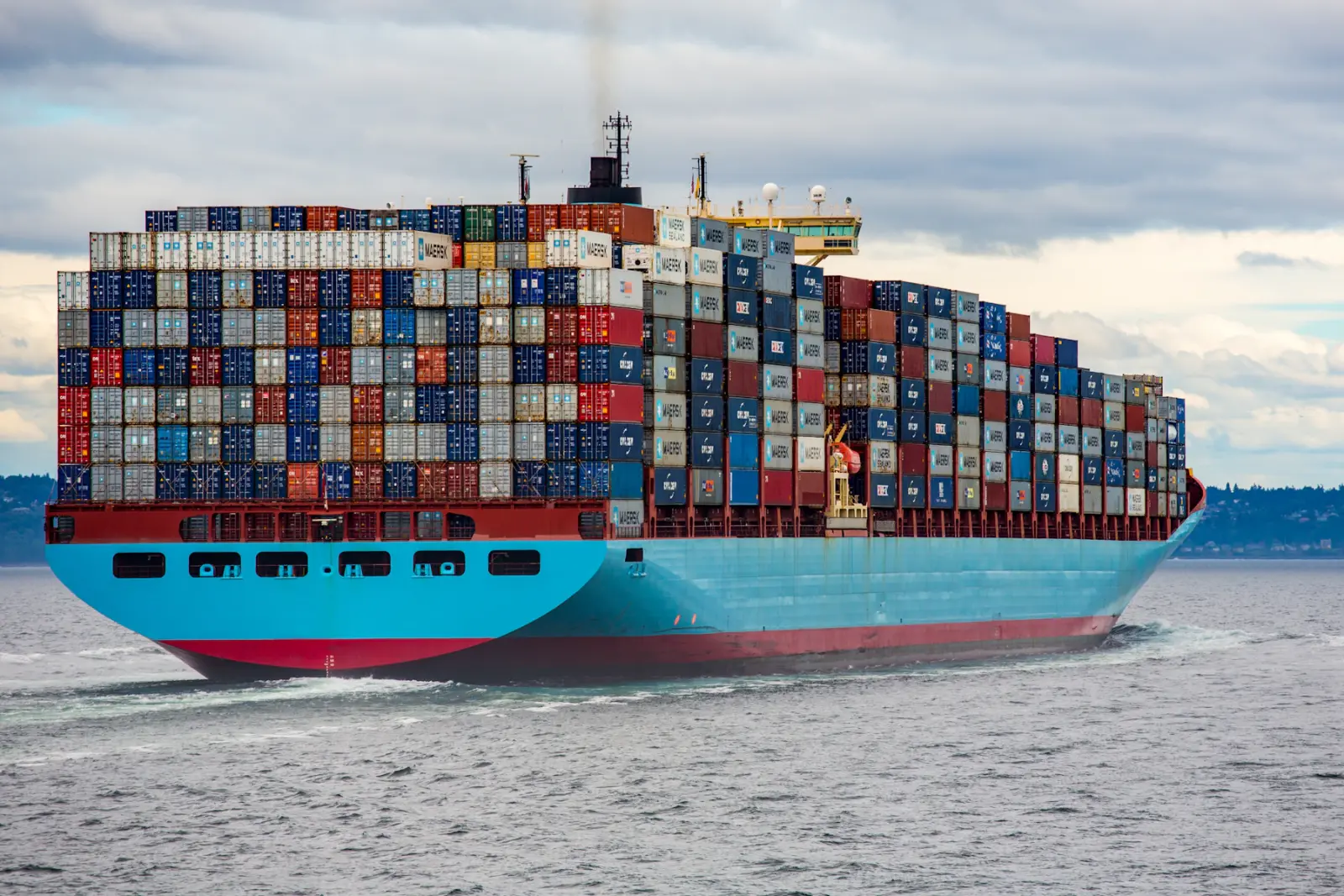 A container ship carrying export cargo across the ocean